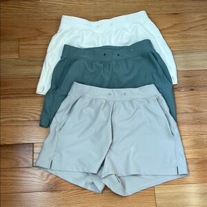 Bundle of Women's High Waisted Athletic Shorts - White, Green, and Light Gray